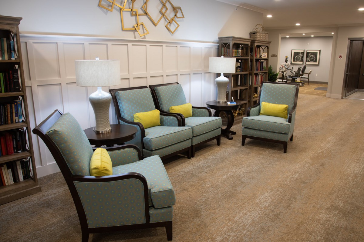 A cozy living room setup with comfortable seating and decorative elements.