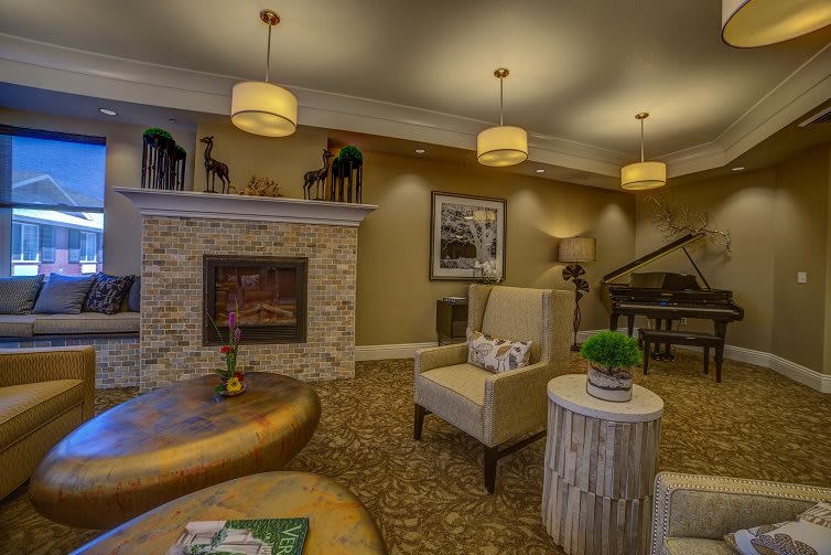A cozy living room with a fireplace and modern interior design.
