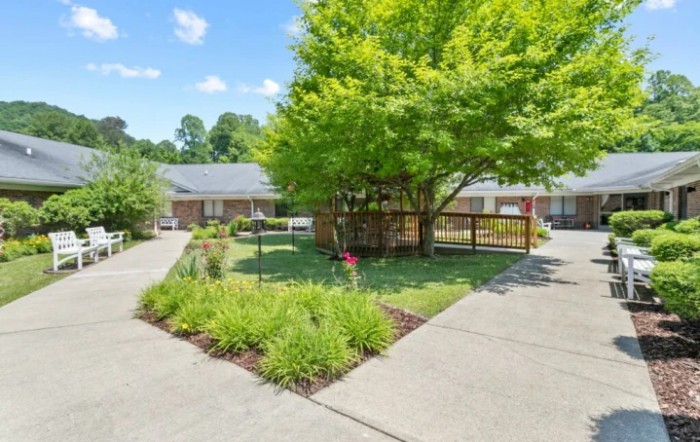 A well-maintained residential property with a landscaped garden and driveway.