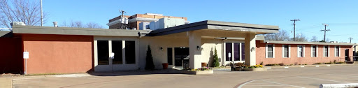 A modern entrance to a commercial building, showcasing clean lines and contemporary design.