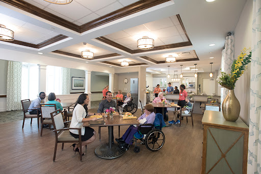 A welcoming dining area in a senior living community, where residents engage in social activities.