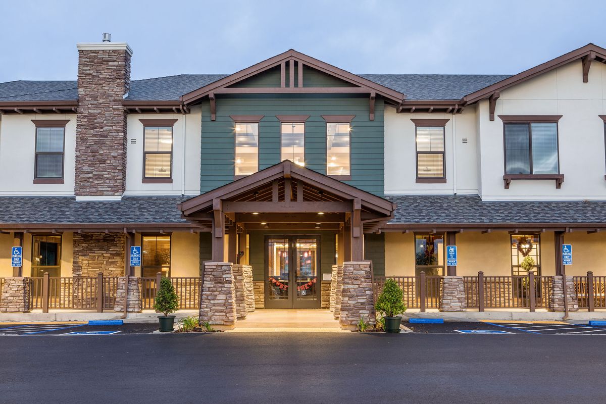 A well-lit hotel exterior with a welcoming entrance.