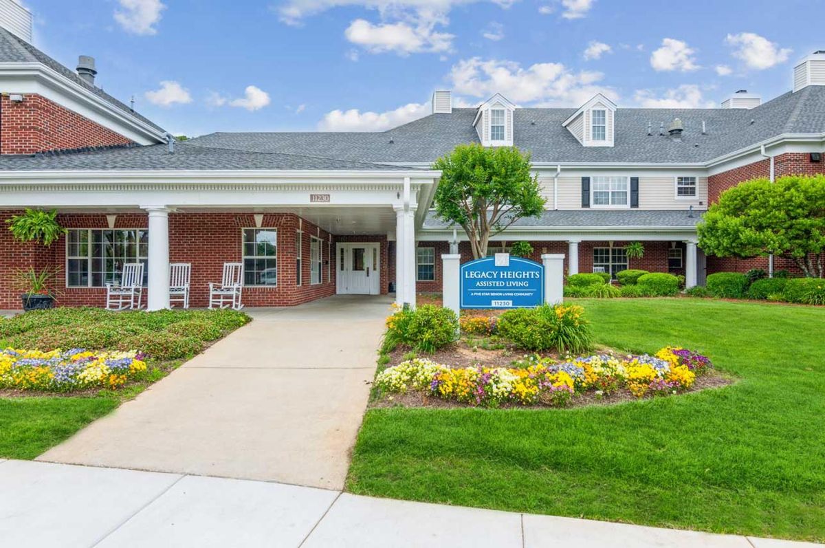 Entrance to a healthcare facility with well-maintained landscaping and signage.