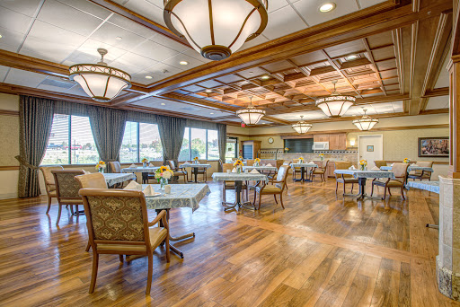 A beautifully designed dining room featuring elegant furniture and warm lighting.