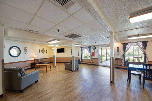A spacious and inviting lounge area featuring comfortable seating and natural light.