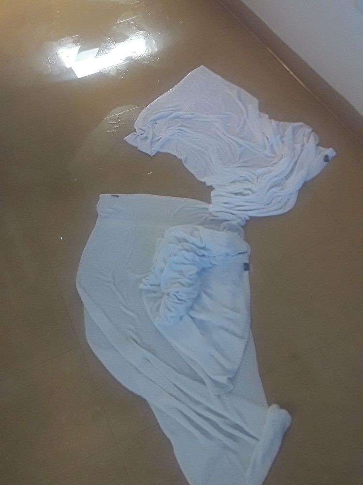 Towels spread out on a wet floor for absorption.
