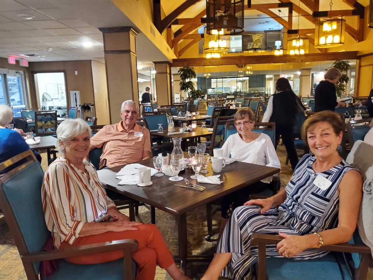 A group of people enjoying a meal together at a restaurant.
