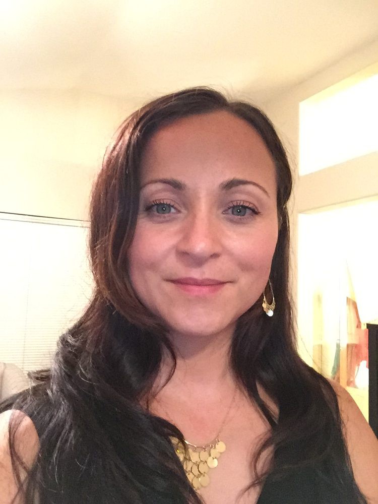 A woman taking a selfie indoors.