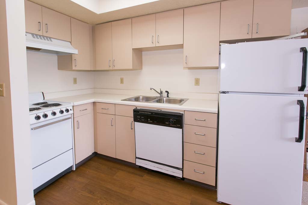A clean and simple kitchen with essential appliances.