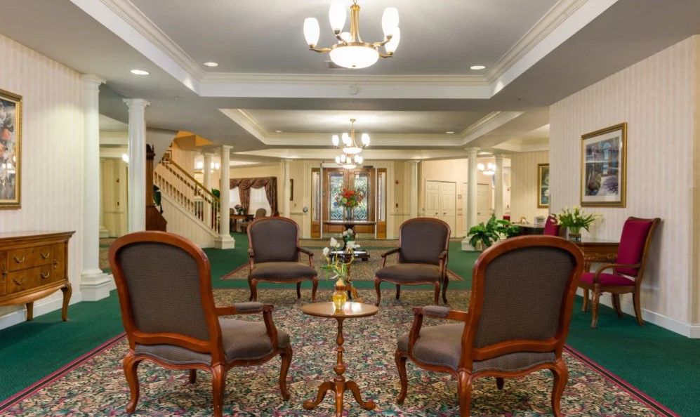 A classic interior lobby with elegant furniture and chandeliers.