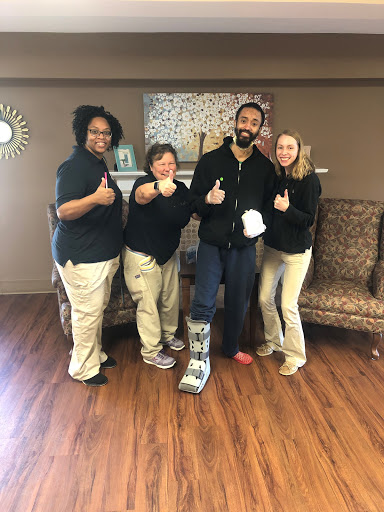 A group of supportive friends giving thumbs up, celebrating recovery together.