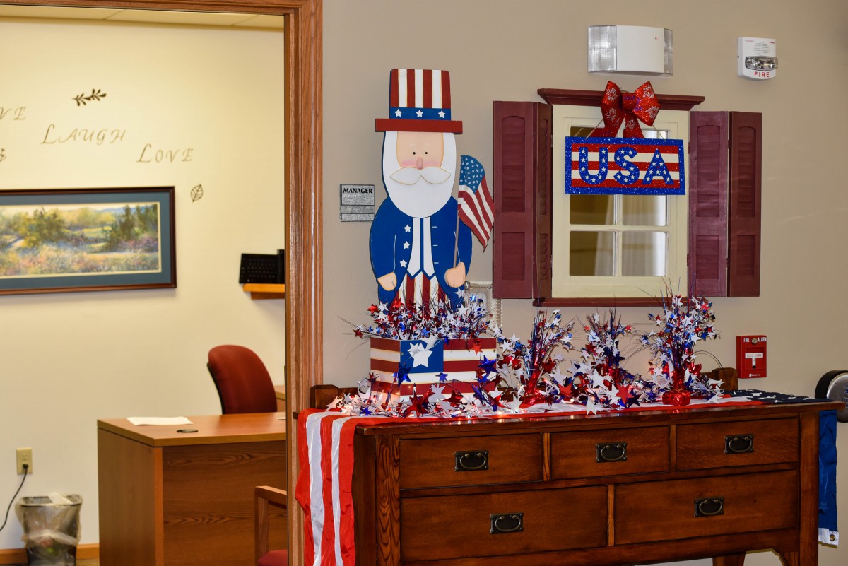 An office decorated with patriotic-themed decorations, featuring red, white, and blue colors.