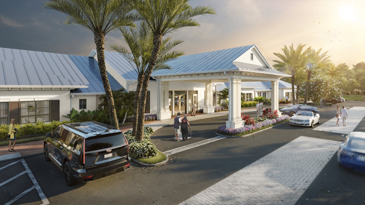 A welcoming entrance to a resort with palm trees and parked cars.