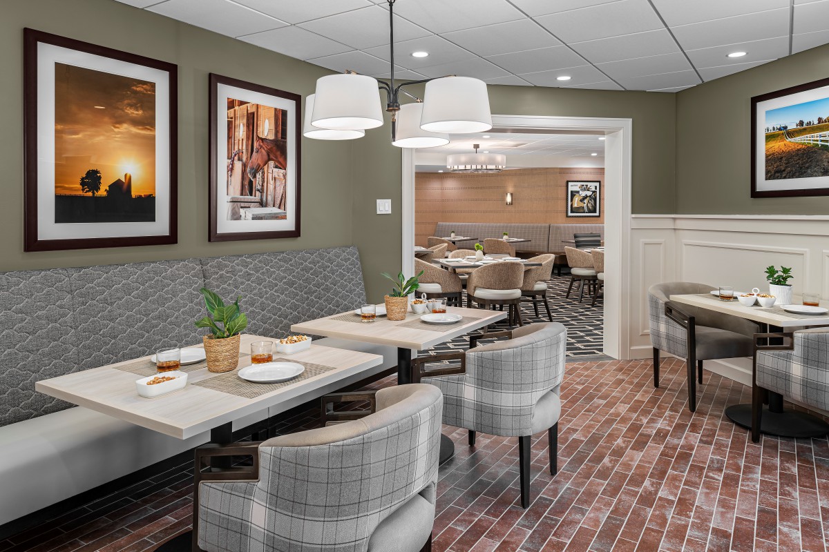 A modern restaurant interior featuring comfortable seating and stylish decor.