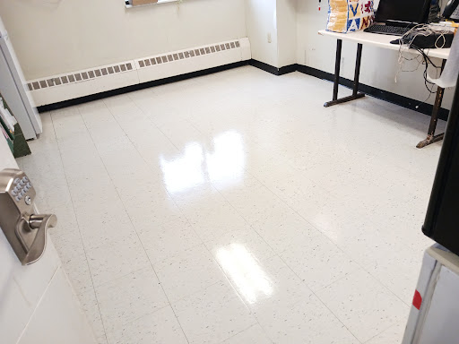 A bright and clean room with a polished floor.