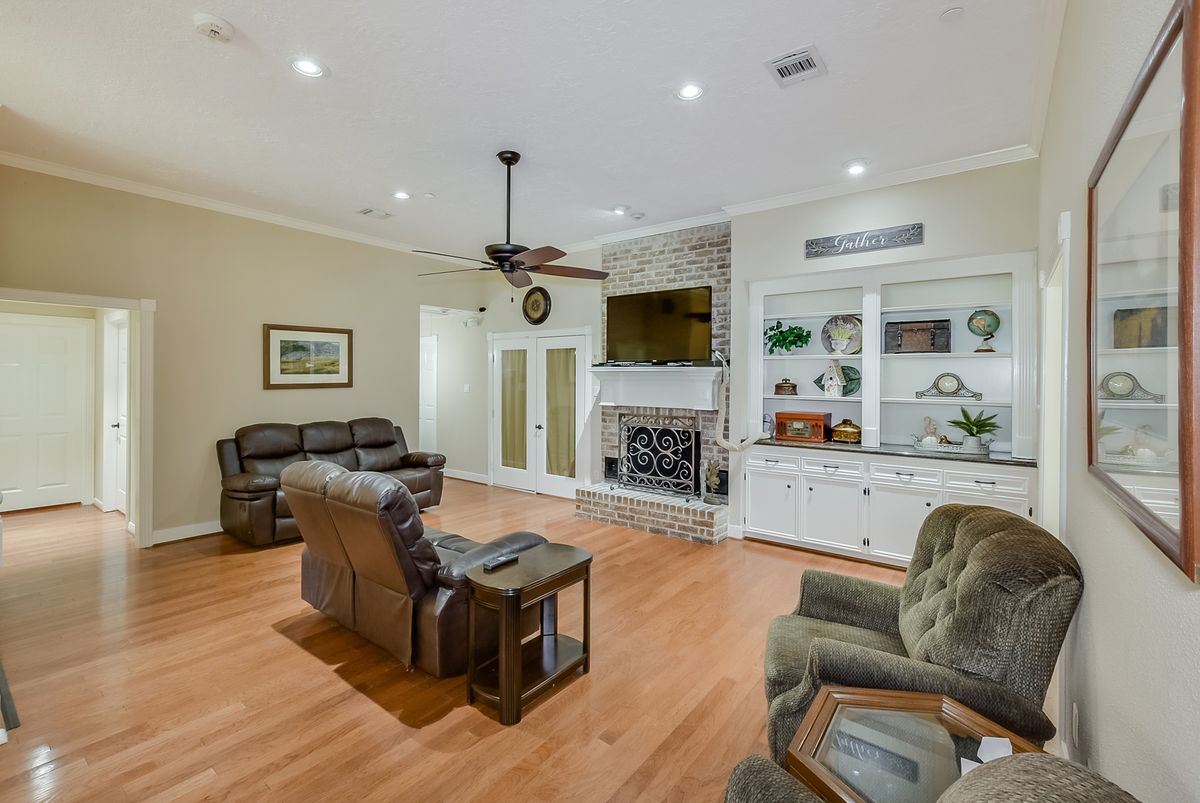 A cozy living room with comfortable seating, a fireplace, and tasteful decor.