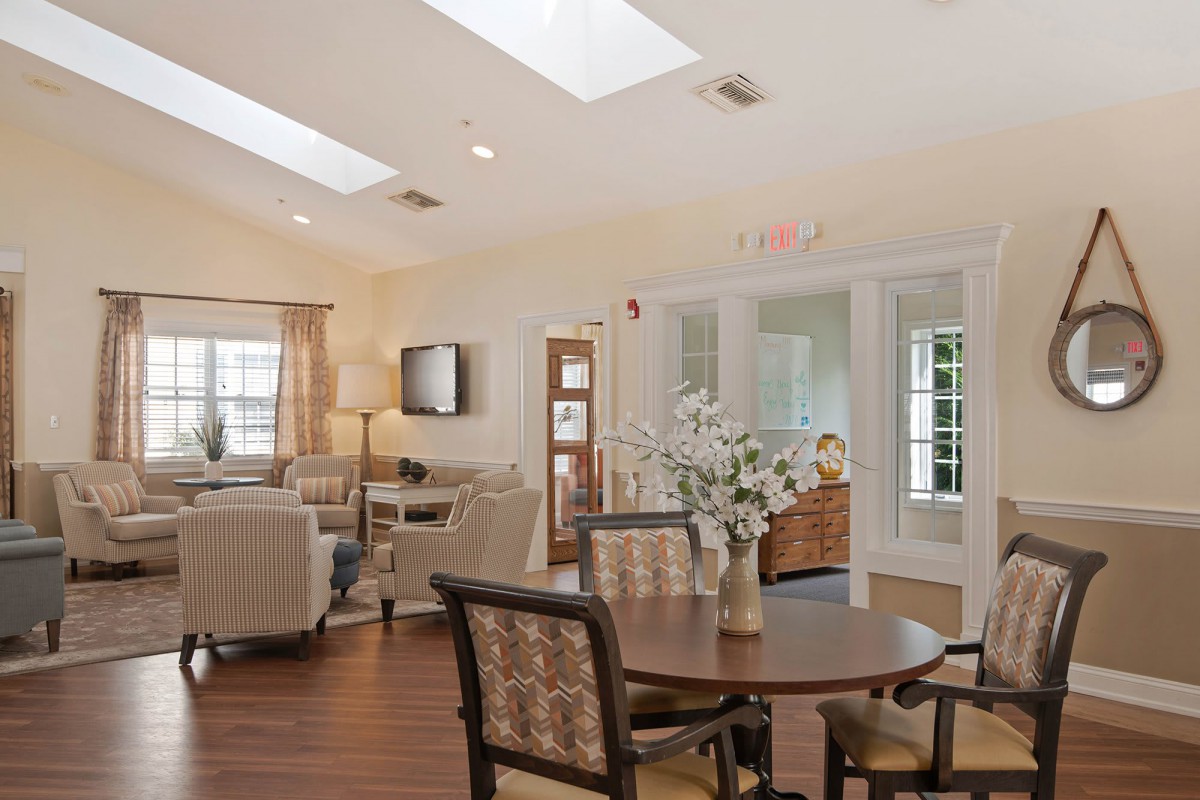 A bright living room with skylights, comfortable seating, and elegant decor.
