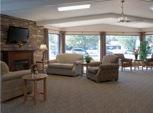 A cozy living room setup with comfortable furniture and ample natural light.