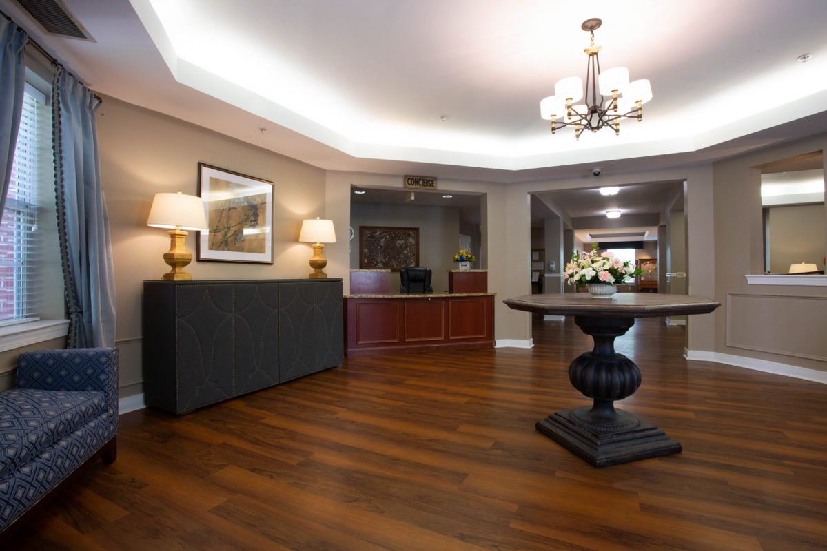 A stylish lobby with elegant lighting and wooden flooring.