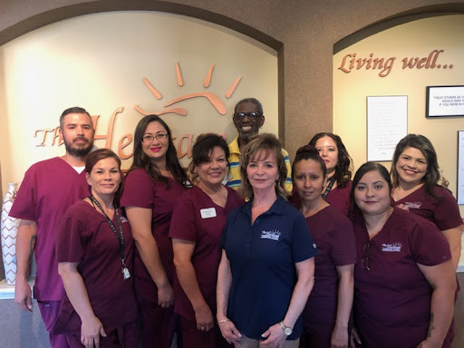 A dedicated team of healthcare professionals posing together.