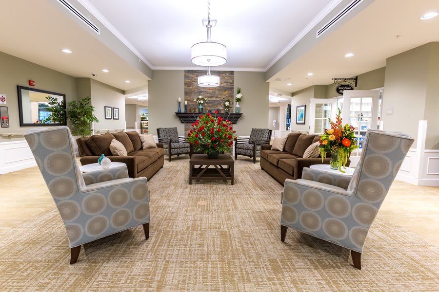 A spacious living room with comfortable seating and elegant decor.