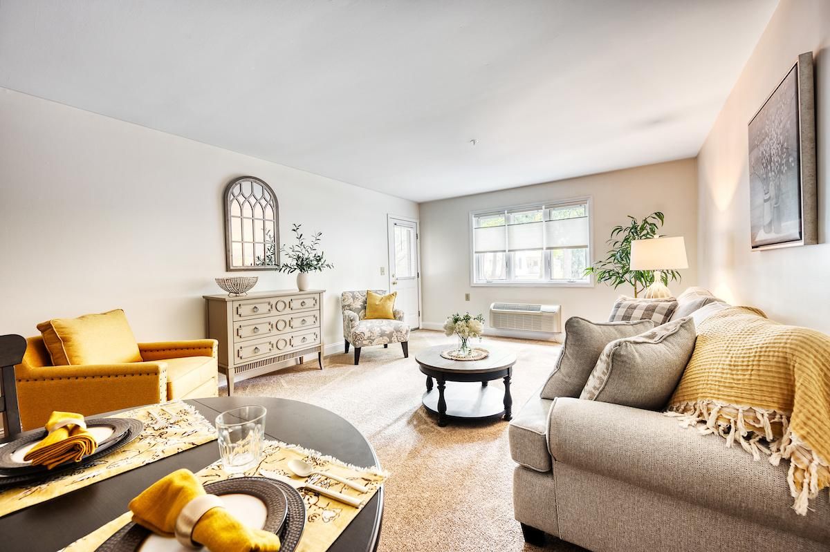 A bright and cozy living room with modern decor and comfortable seating.