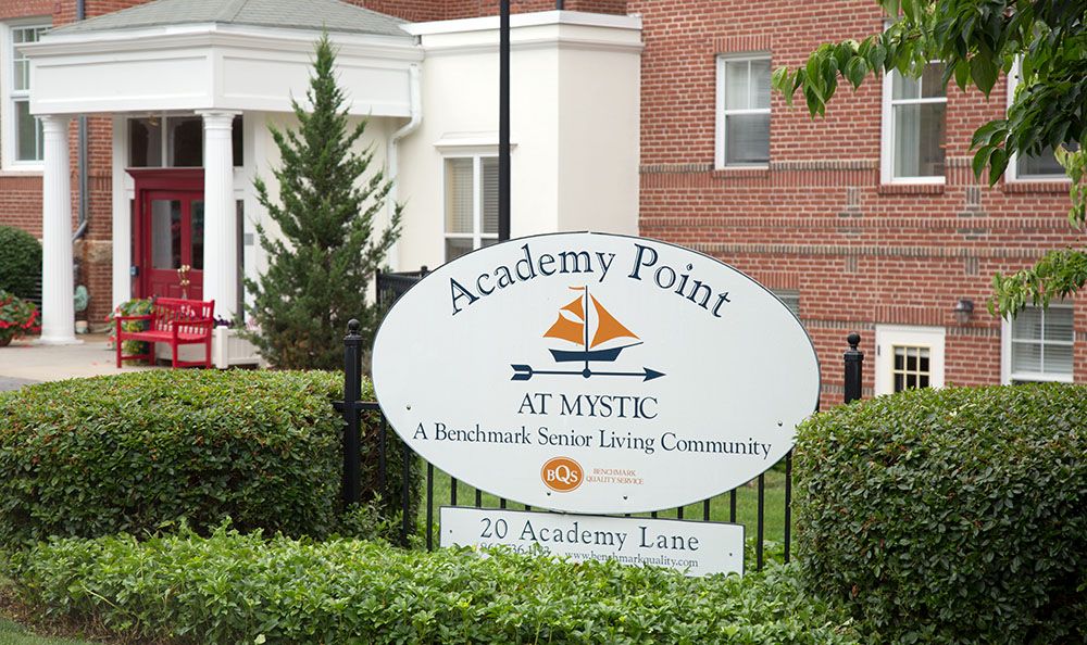 Sign for Academy Point at Mystic, a senior living community.