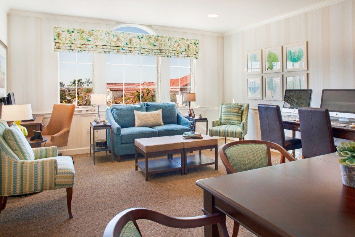 A cozy and well-decorated living room with various seating options and natural light from the windows.