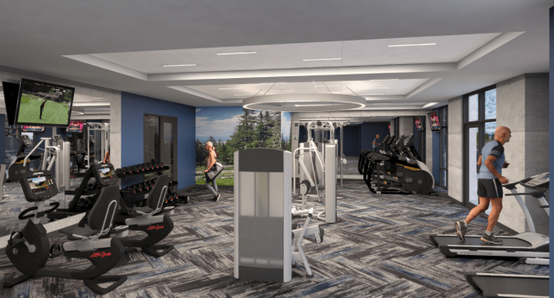 A modern gym equipped with various workout machines and exercise equipment.