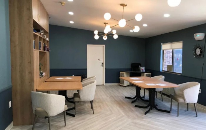A modern office space with stylish furniture and contemporary lighting.