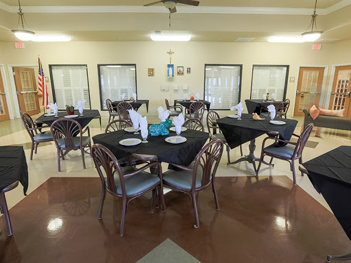 A well-arranged dining area with neatly set tables, ready for patrons.