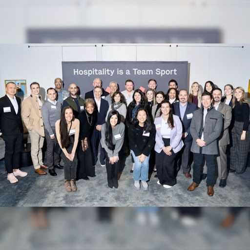 A diverse group of professionals gathered to celebrate the spirit of teamwork in the hospitality industry.