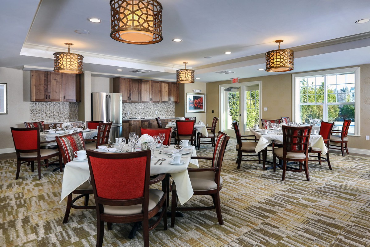 A well-decorated dining area with elegant furniture and ambient lighting.