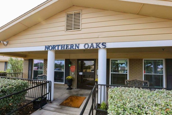 Entrance to the Northern Oaks building with exterior signage.