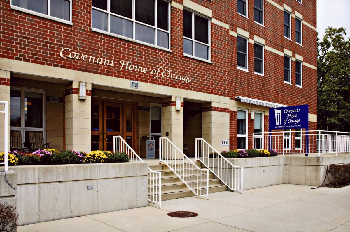 The entrance to a brick building with stairs leading up, labeled as 'Covenant House Chicago'.