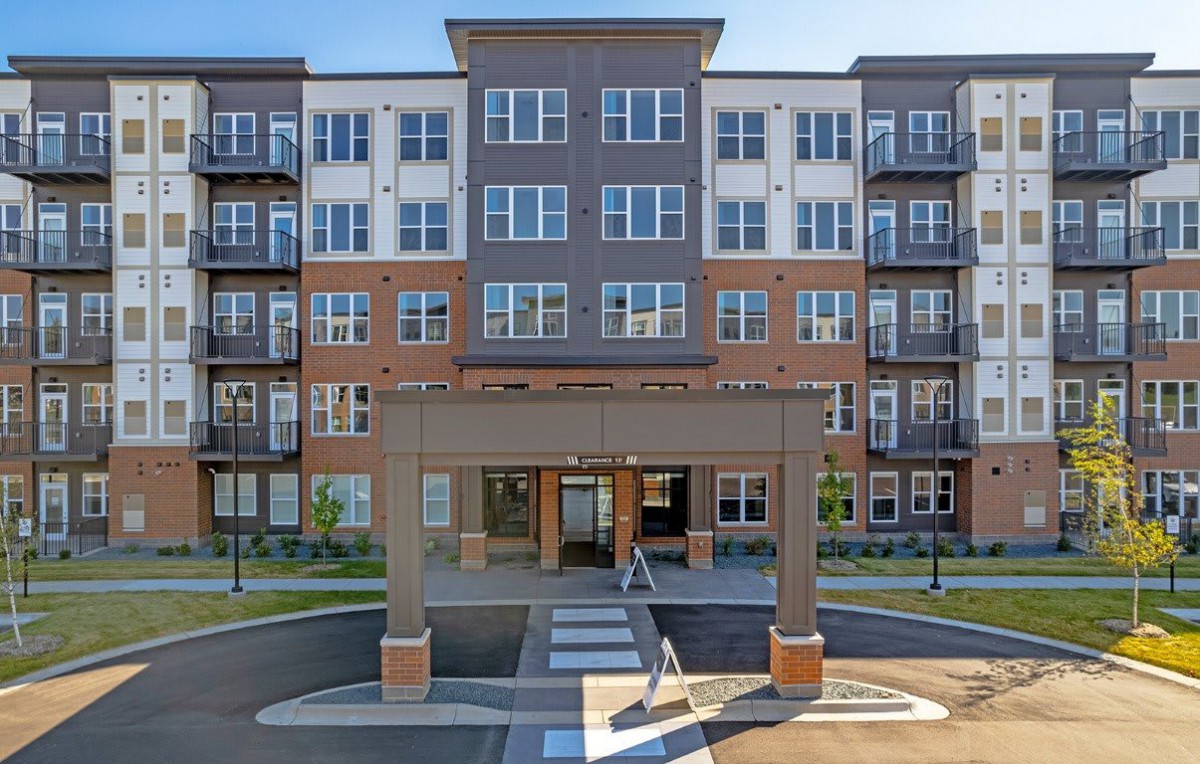 A modern apartment complex with a welcoming entrance.