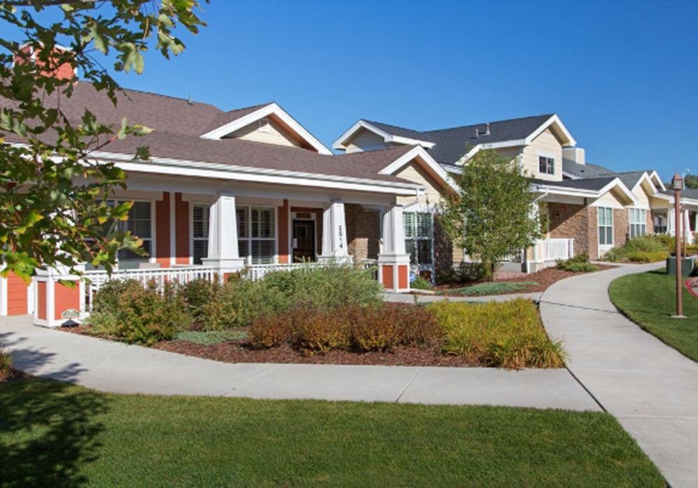 A suburban residential house with a lawn and garden.