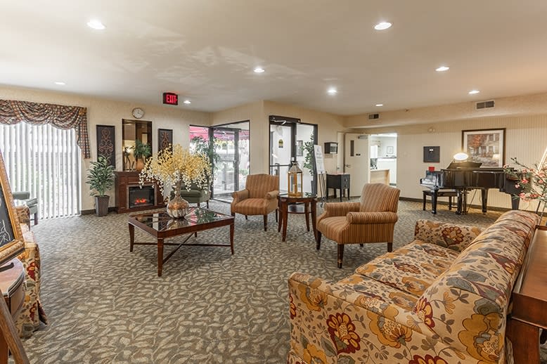 A spacious lobby area featuring comfortable seating and elegant decor.