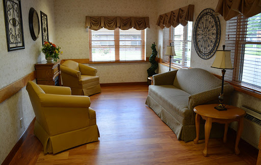 A cozy living room featuring comfortable seating and natural light.
