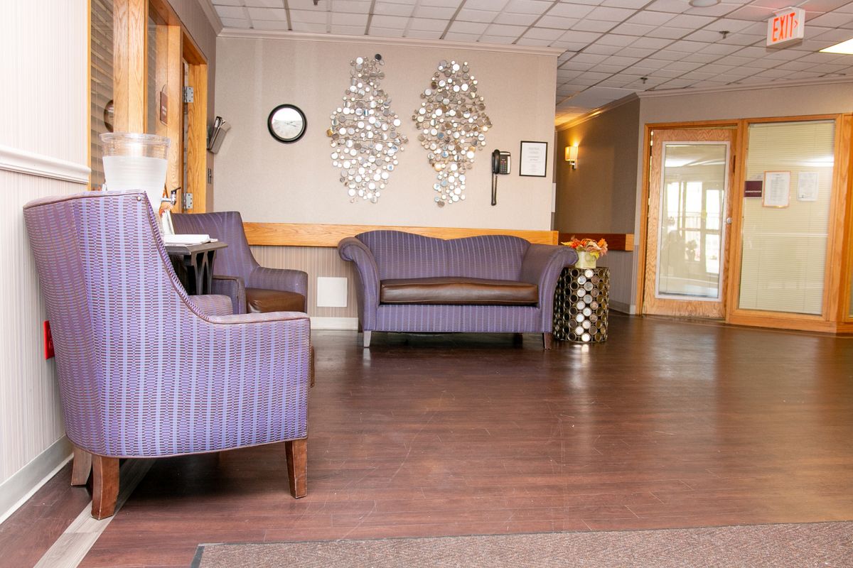 A modern waiting room with comfortable seating and stylish decor.