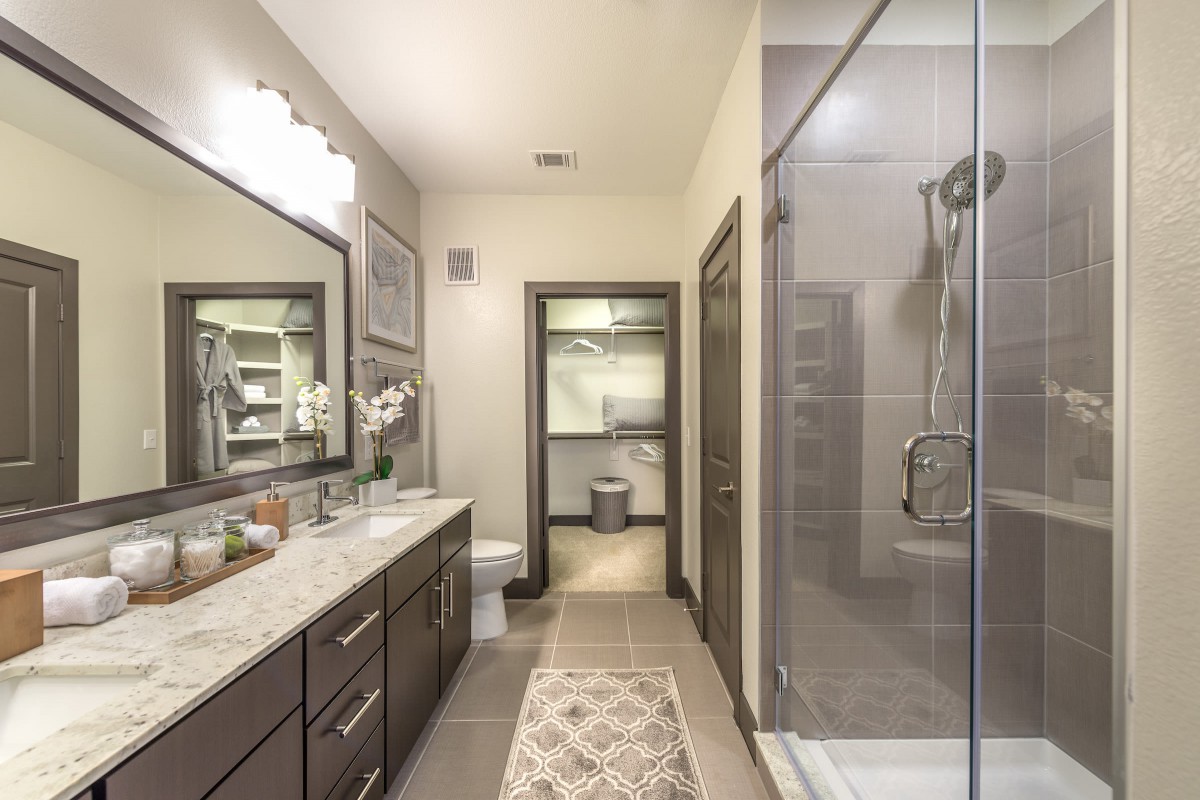 Elegant modern bathroom with a spacious shower and double vanity.