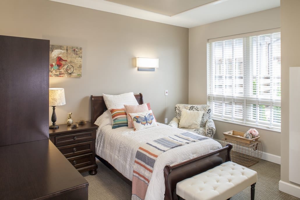 A cozy and modern bedroom with a single bed and stylish decor.
