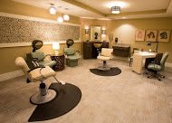 A cozy and stylish hair salon interior with comfortable seating and modern decor.