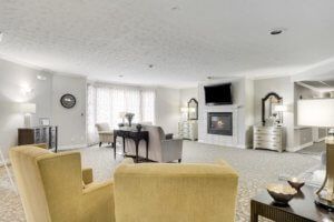 A bright and modern living room featuring comfortable seating and a fireplace.