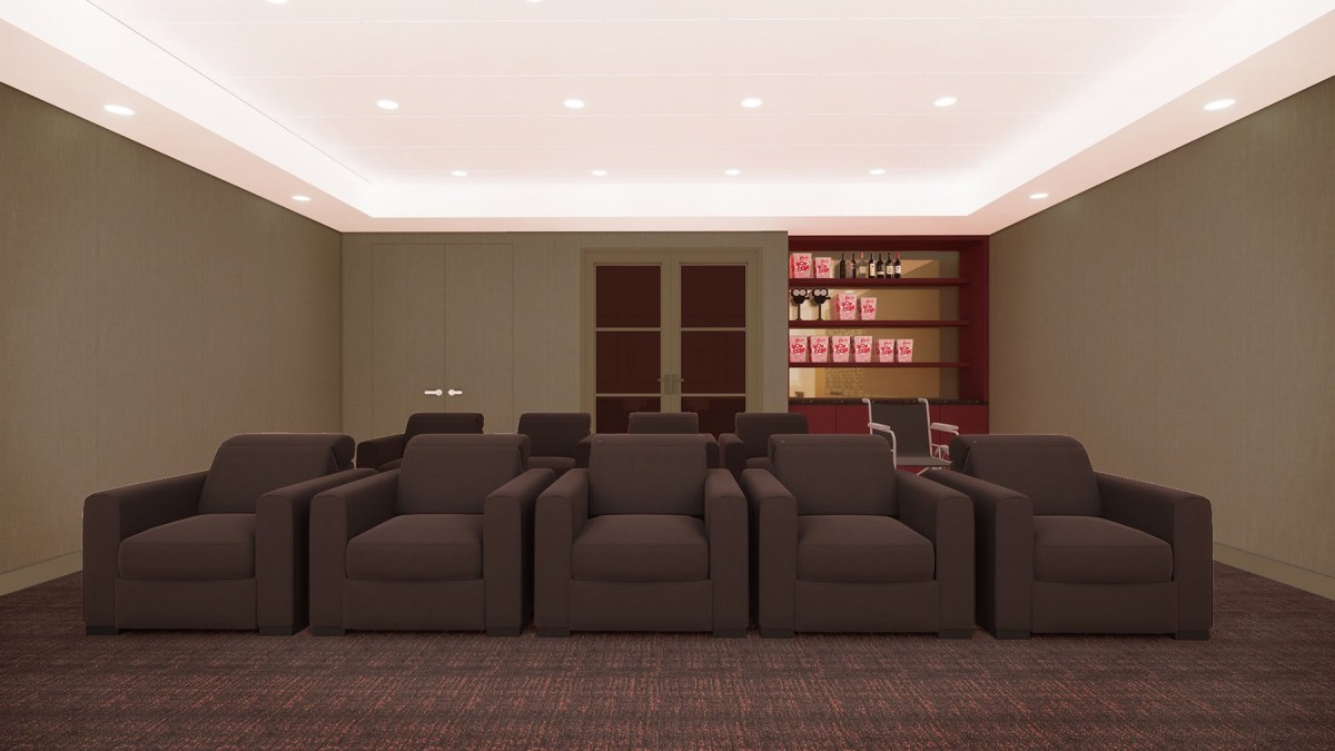 A well-lit room with comfortable seating and book-filled shelves.