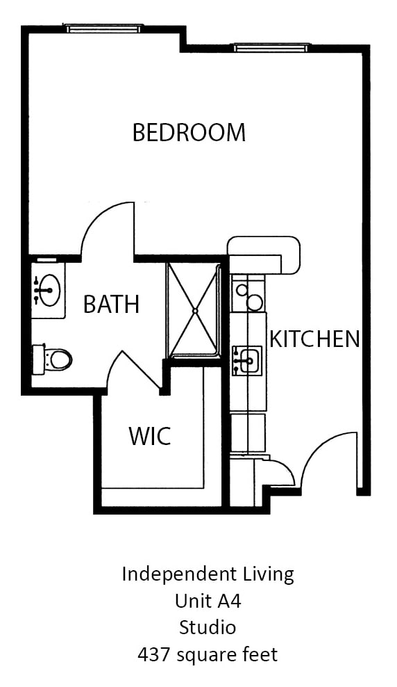 A compact floor plan featuring a kitchen, bathroom, and walk-in closet.