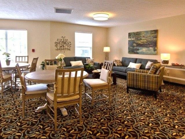 A cozy living room with comfortable seating and elegant decor.