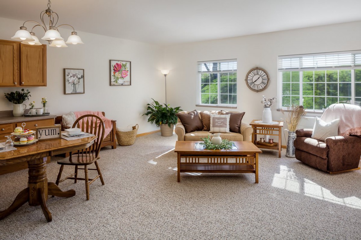 A cozy living room with a dining area featuring comfortable furniture and tasteful decor.