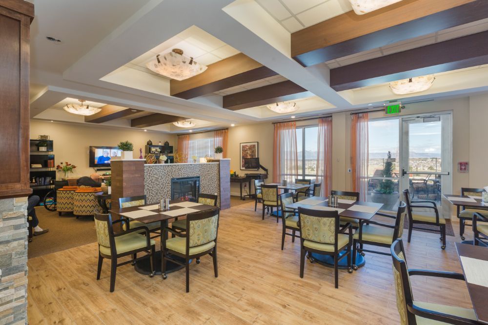 Elegant dining area with modern furniture and warm lighting.