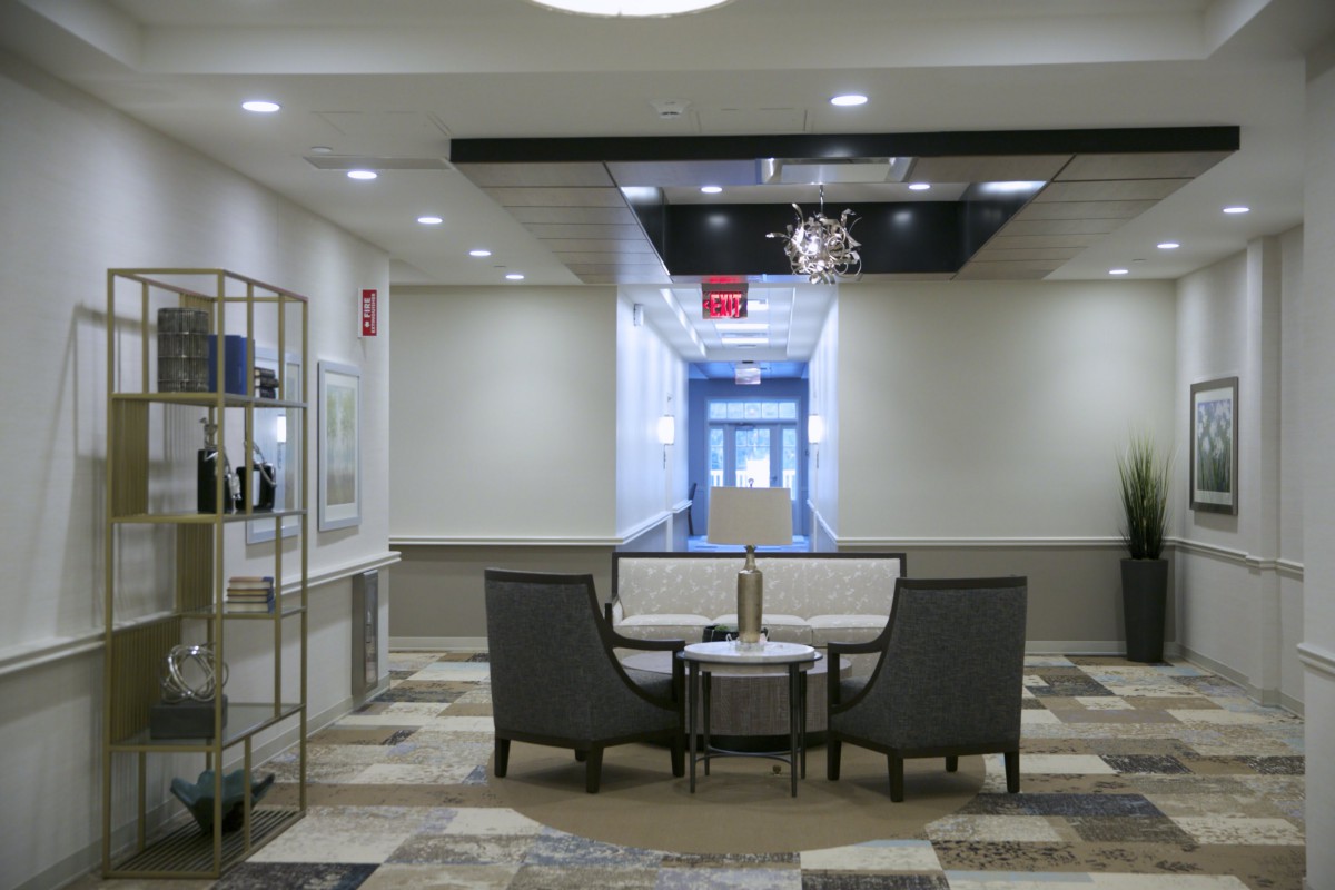 A modern lobby interior with comfortable seating and stylish lighting.